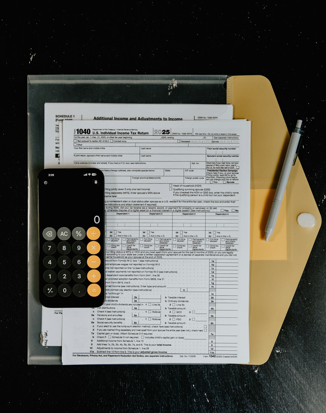 calculator on desk with documents