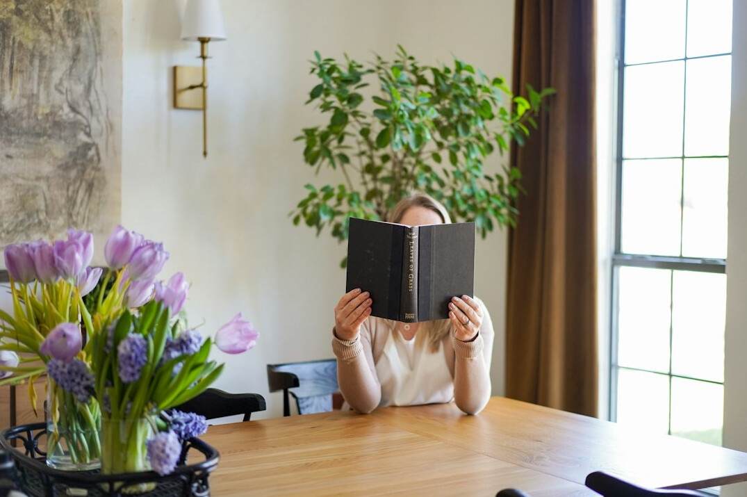 happy retired woman reading book