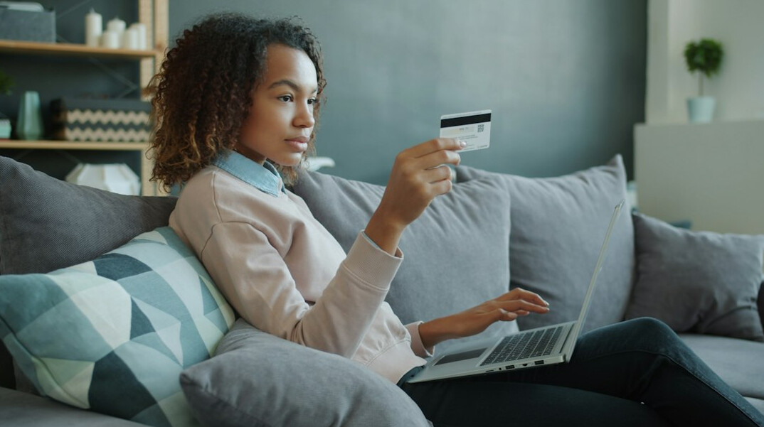 woman checking finances on laptop