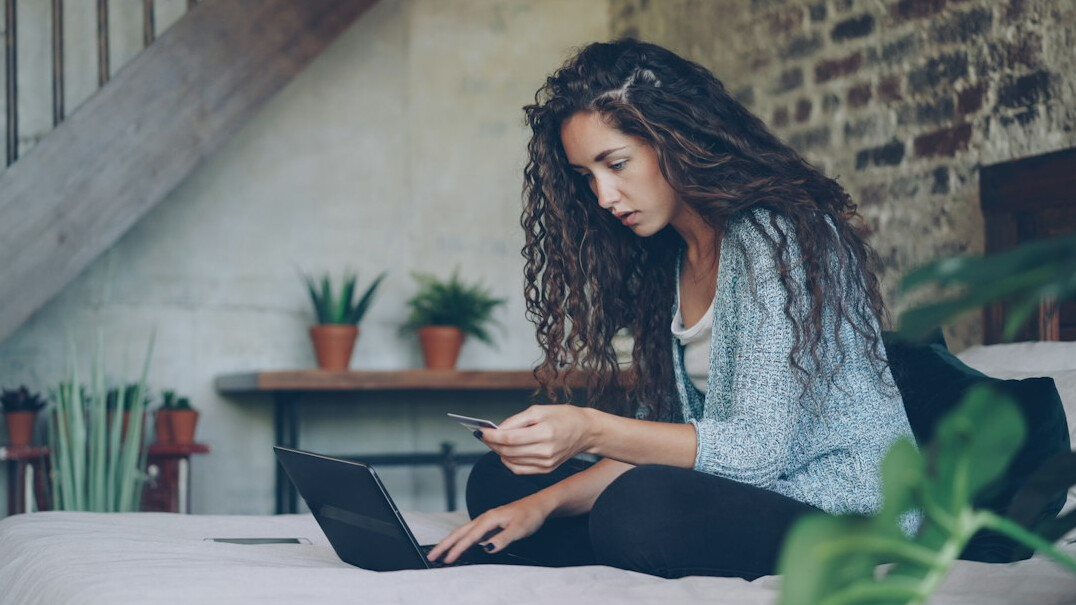 woman calculating budget at home