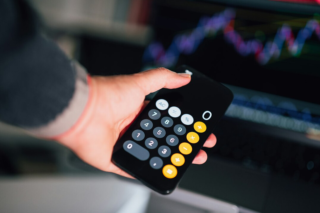 person reviewing investment calculator